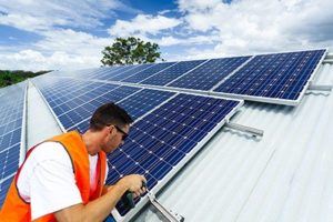 man installing solar